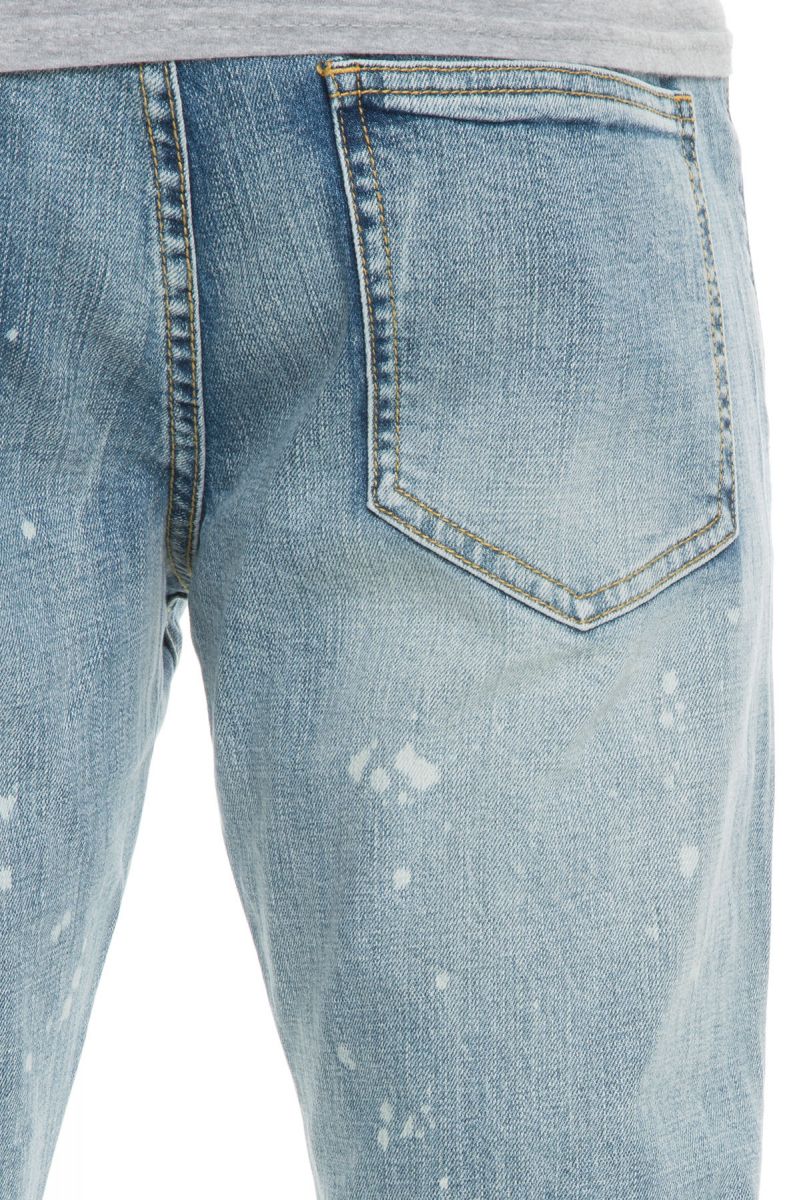 The Bullet Exposed Ripped Bleach Splatter Denim Jeans in Blue