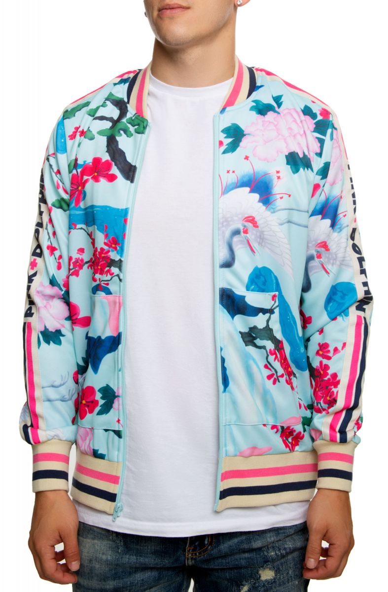 light blue track top