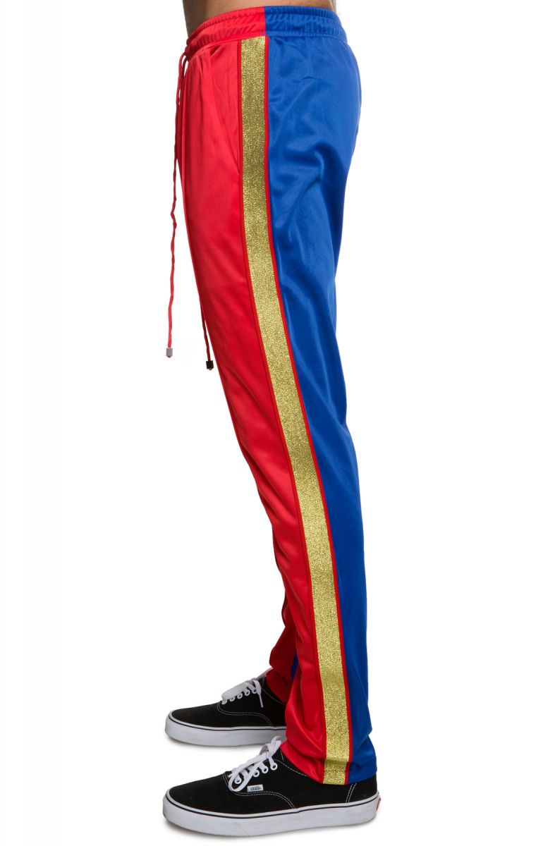 blue track pants with red stripe