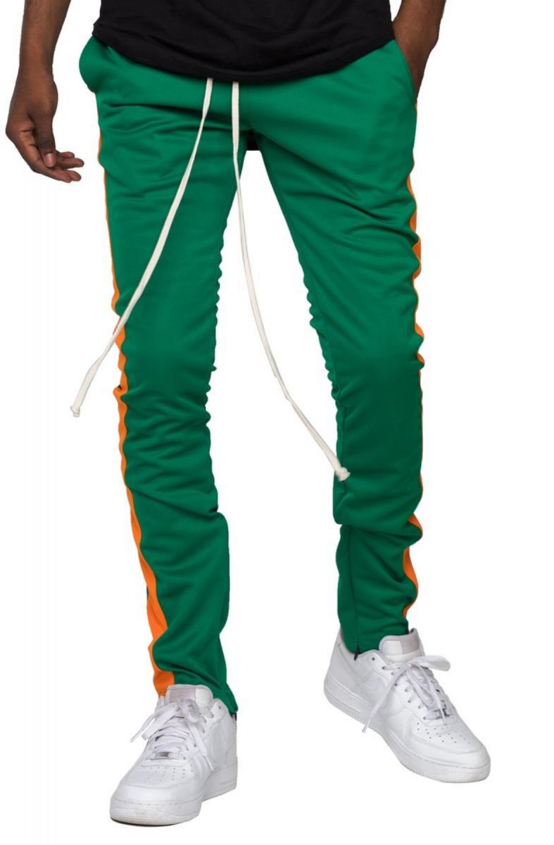 green and orange track pants