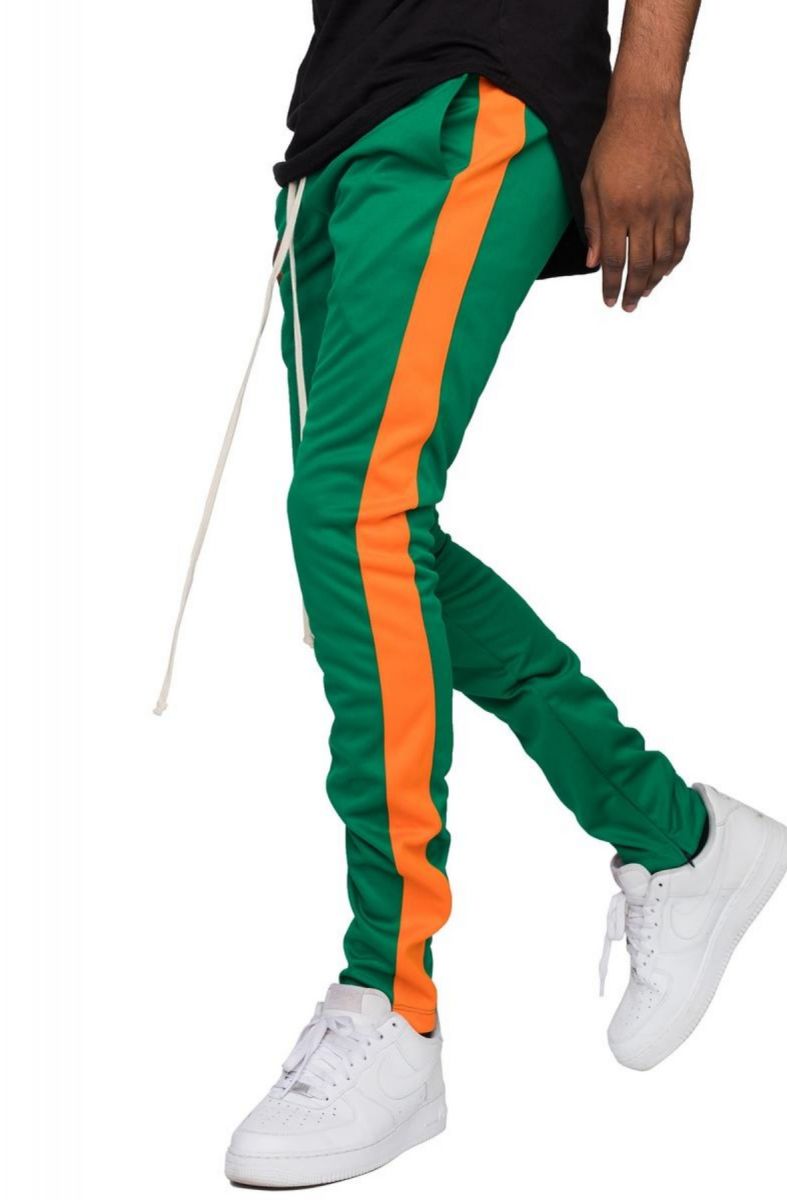 green and orange track pants