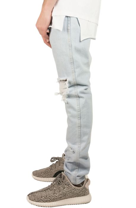 The Ripped Tapered Denim Jeans in Bleached Indigo