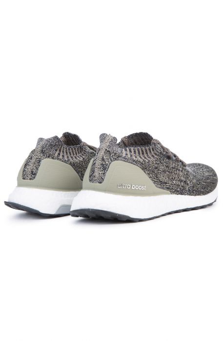 The Men's Ultraboost Uncaged in Trace Cargo, Core Black and Chalk Pearl