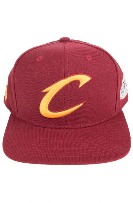 The Cleveland Cavaliers Tonal N Gold Snapback in Burgundy