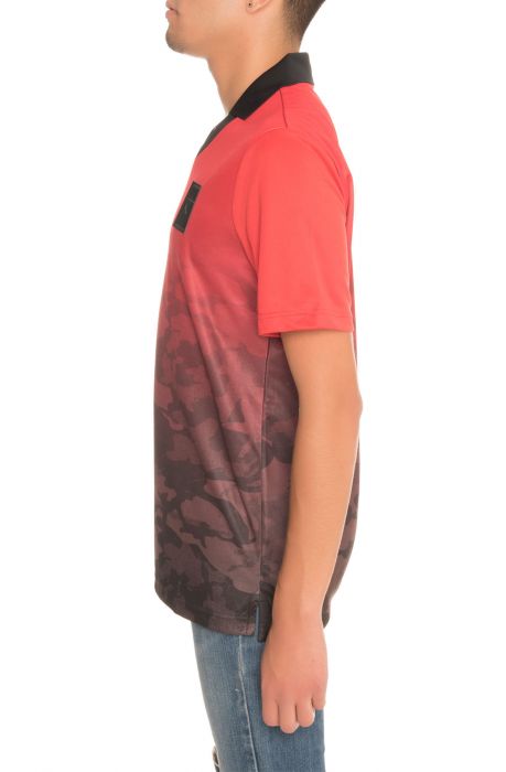 The Puma x Trapstar Football Tee in Barbados Cherry and Trap Camo