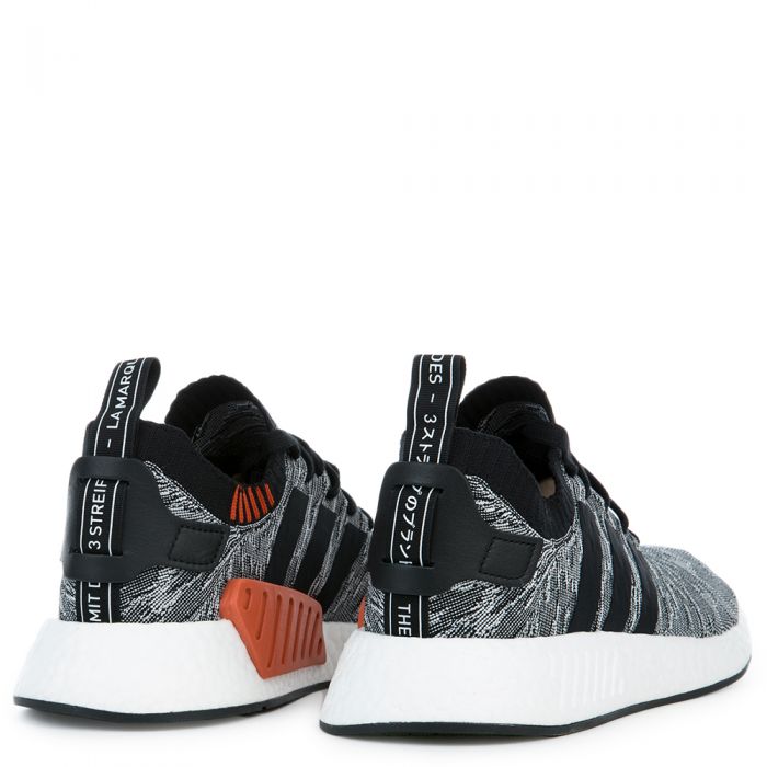 The NMD_R2 PK in Coral Black and White