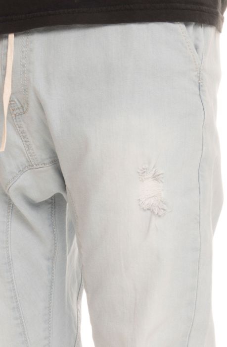 The Distressed Denim Joggers in Bleached Stone Washed Blue Light Blue Stone