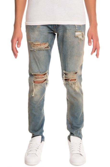 The Tapered Vintage Wash Ripped Denim Jeans in Dirty Indigo