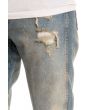 The Tapered Vintage Wash Ripped Denim Jeans in Dirty Indigo