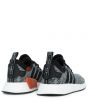 The NMD_R2 PK in Coral Black and White 4