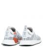 The NMD_R2 PK in White and Coral Black 4