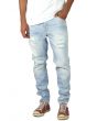 The Light Stonewashed Ripped Tapered Denim Jeans in Light Blue 1