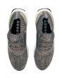 The Men's Ultraboost Uncaged in Trace Cargo, Core Black and Chalk Pearl 4